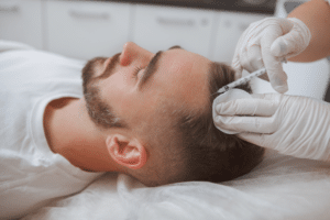 man getting hairloss injections treatment