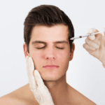 Hands Injecting Syringe With Botox For Face Treatment