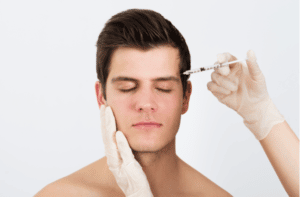 Hands Injecting Syringe With Botox For Face Treatment
