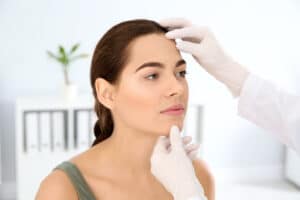 Woman in Sarasota, FL is examined by a licensed dermatologist for a cosmetic and medical assessment.