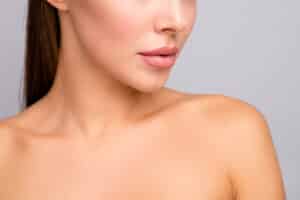 Beautiful woman with voluminous features like full cheeks and lips thanks to dermal filler injections administered by a dermatologist