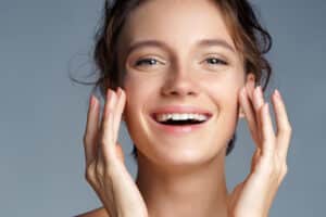 Cute brunette woman enjoys gorgeous skin tone and texture with IPL treatments.