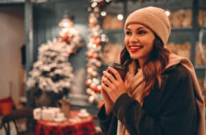 Woman in winter hat and scarf has glowing skin after a chemical peel during the cold months.