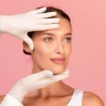 Woman has her skin studied for unwanted signs.