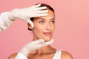 Woman has her skin studied for unwanted signs.